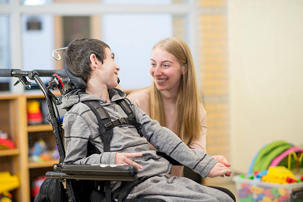 istock Caregiver Working with a Child 585800046