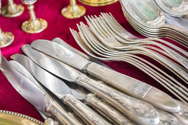 istock bunch of old silver ware on a flea market 585800100