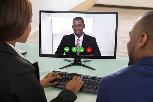 Businesspeople Having Videoconference Stock Photo - Download Image Now
