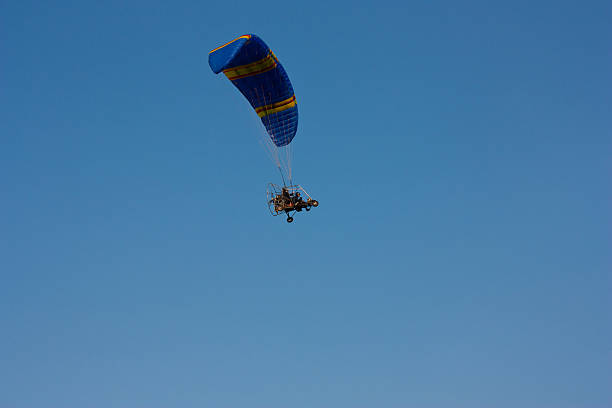 istock paraglider with a motor in  sky 585800584