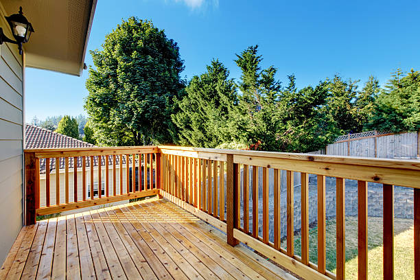 istock Unfurnished small walkout deck with backyard view. 585801014