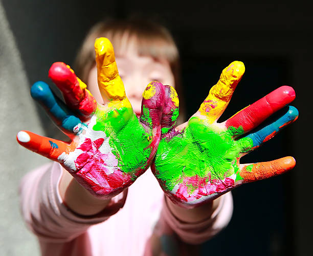 istock Cute little kid with painted hands 585801240