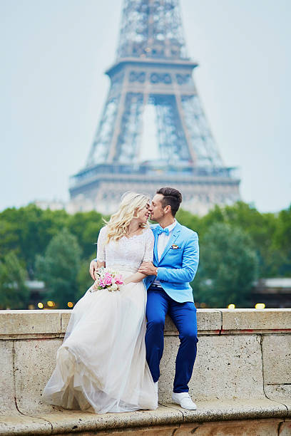 istock Just married couple near the Eiffel tower in Paris 585801834
