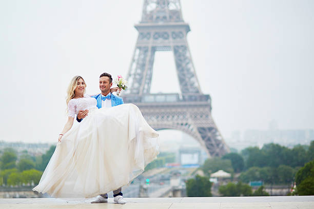 istock Just married couple near the Eiffel tower in Paris 585802784