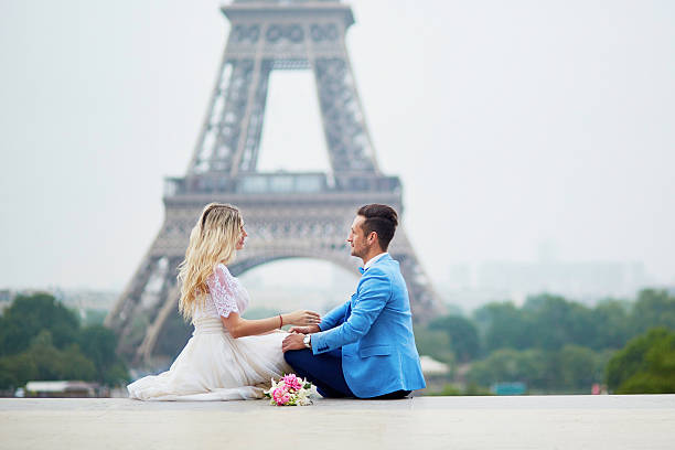 istock Just married couple near the Eiffel tower in Paris 585802872