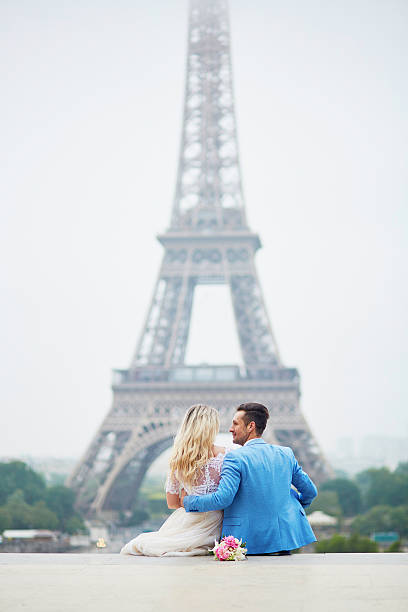 istock Just married couple near the Eiffel tower in Paris 585802958