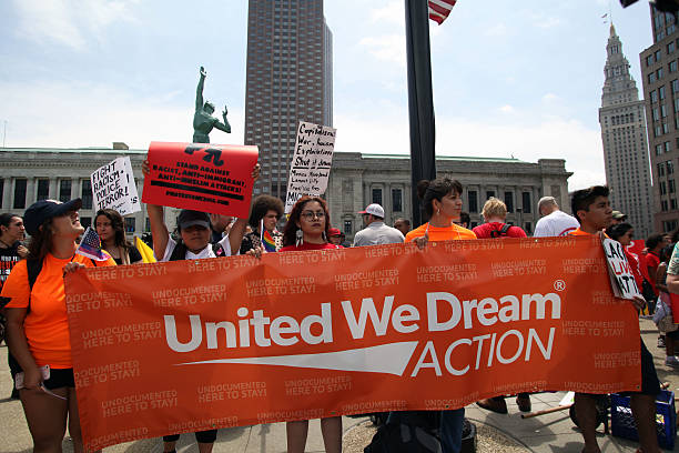 Republican National Convention, July 18, 2016 Cleveland, Ohio, USA - July 18, 2016: Young Hispanics support the Dream Act at the "Stop Trump" march on the first day of the Republican National Convention. DACA (the Deferred Action for Childhood Arrivals) program defers immigration enforcement action against young people brought to the U.S. illegally as children. rnc stock pictures, royalty-free photos & images