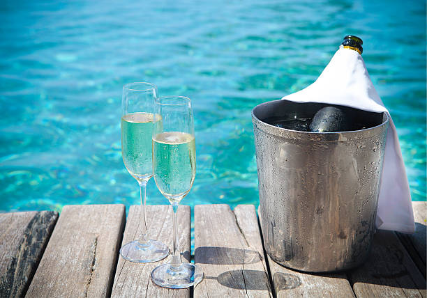 istock Champagne bottle in ice bucket and two glasses 585803906