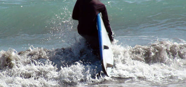 Surfer With Surfing Board At Kuta Beach In Bali.Indonesia