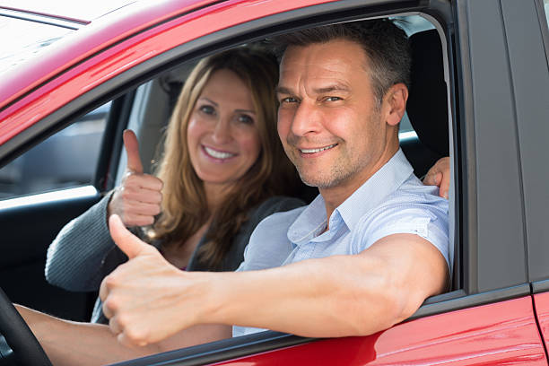 istock Couple Sitting Inside The Car 585805634
