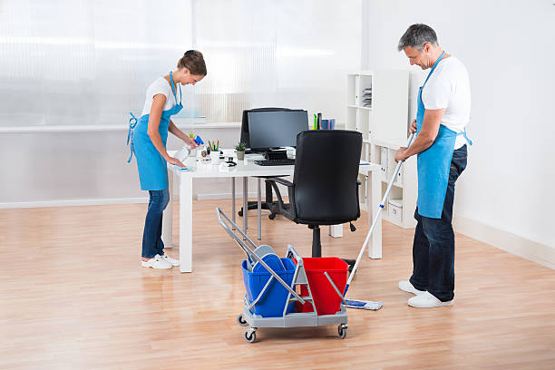 istock Cleaners With Cleaning Equipments Cleaning The Office 585806410