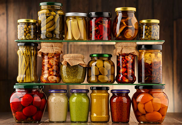 istock Jars with variety of pickled vegetables. 585807406