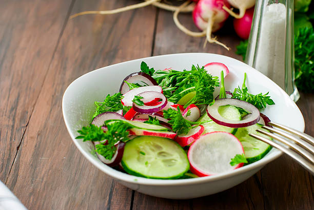 istock spring salad of radishes, cucumbers 585807674
