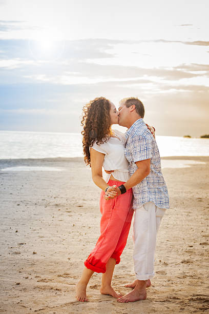 istock Romantic Couple Kissing on the Beach Portrait 585809094