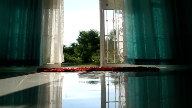 curtain blowing in the wind at hot summer day