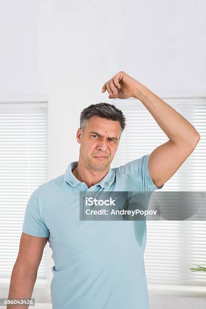 Man Sweating Very Badly Under Armpit Stock Photo - Download Image Now - Hyperhidrosis, Armpit, Men