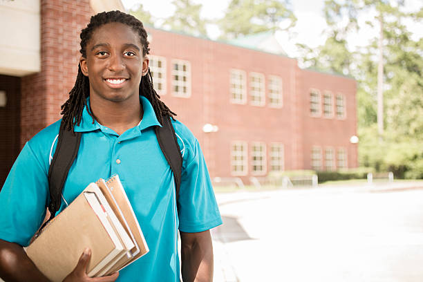 istock African-descent boy on college school campus. 586043938