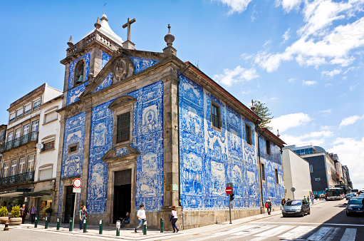 Porto, Portugal - June 19, 2013: Capela das Almas (Capela de Santa Catarina). Located on the pedestrian Santa Catarina Street and decorated with the typical Portuguese Tiles (Azulejos) by painter Eduardo Leite