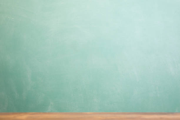 istock Back to school background with desk and green chalkboard. 586044694