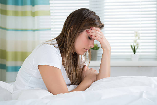 istock Woman Suffering From Headache 586044808