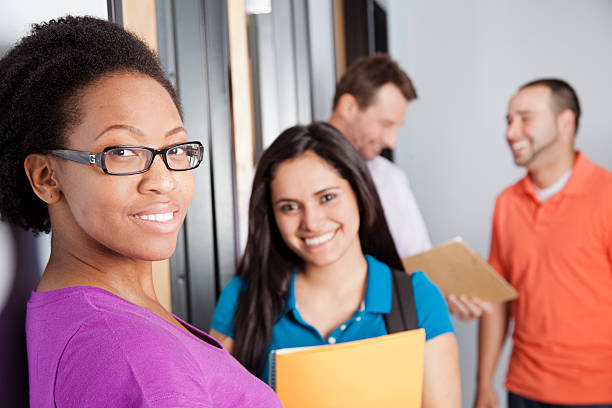 istock Education: Multi-ethnic group of college students in classroom. 586045890