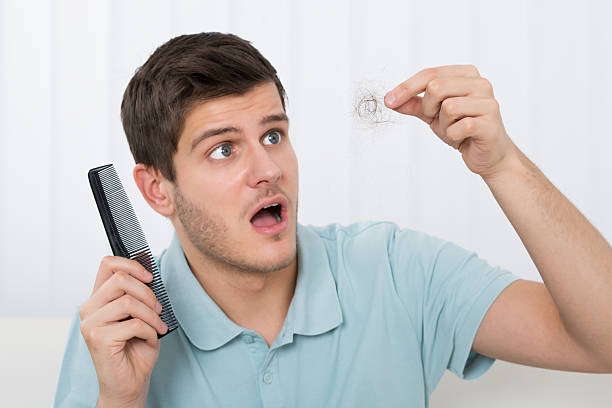 istock Man Suffering From Hair Loss 586046378