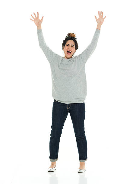 istock Cheerful woman cheering with hands raised 586047798