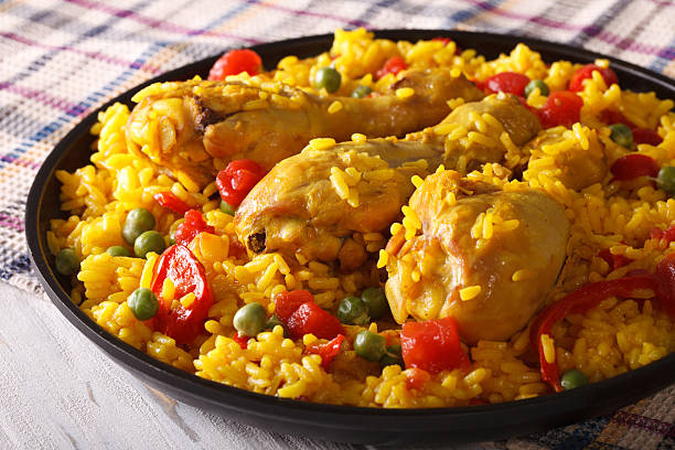 istock Paella with chicken meat and vegetables closeup. horizontal 586050080