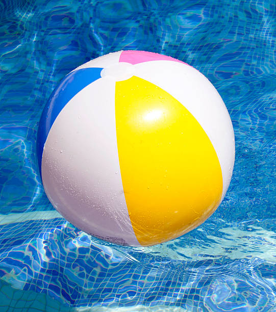 istock Ball floating in a blue swimming poo 586051196