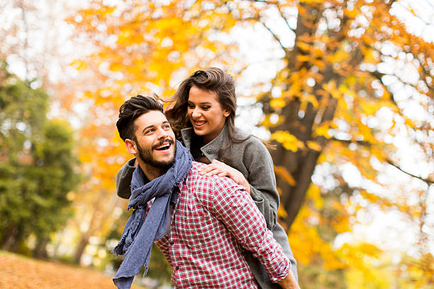 istock Young couple in the autumn park 586052362