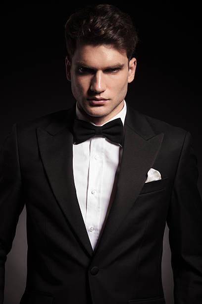 istock elegant man wearing a black tux. 586054840