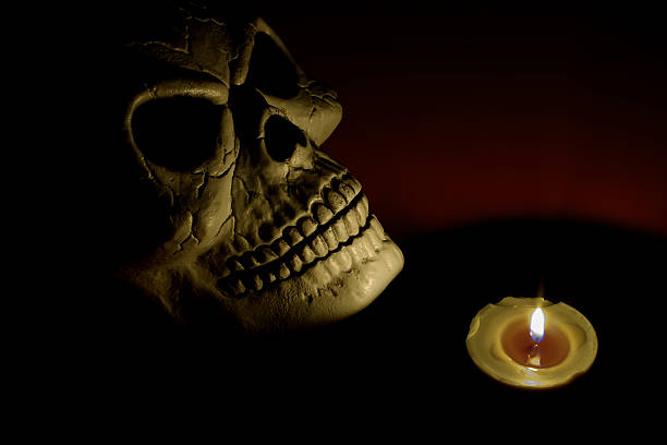 Skull Lit By A Candle Black Background Halloween Theme Stock Photo -  Download Image Now - iStock
