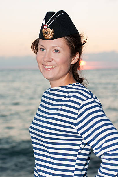 istock girl in a striped vest and his cap 586056016