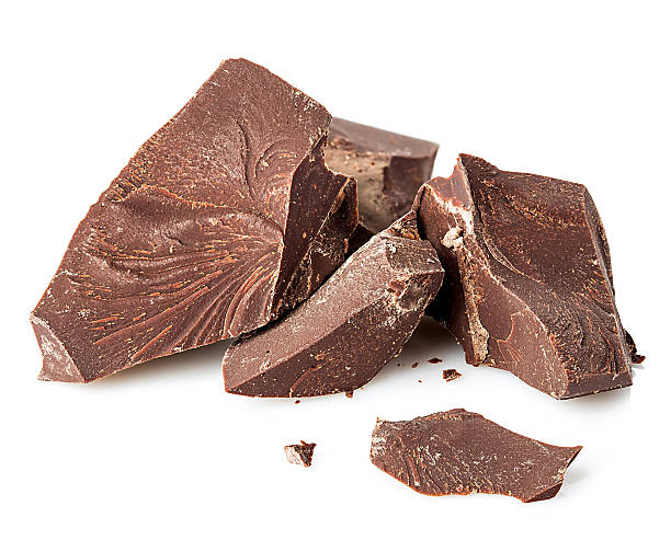 istock Chocolate pieces close-up isolated on a white background. 586057098