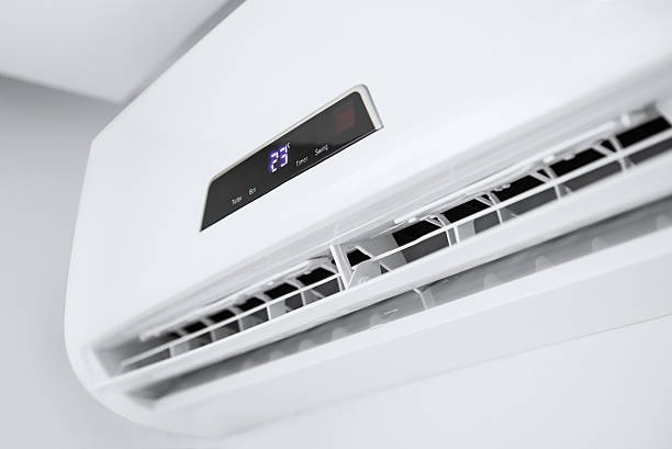 Split air conditioner on a white wall. Split air conditioner on a white wall. Closeup image. air conditioner photos stock pictures, royalty-free photos & images