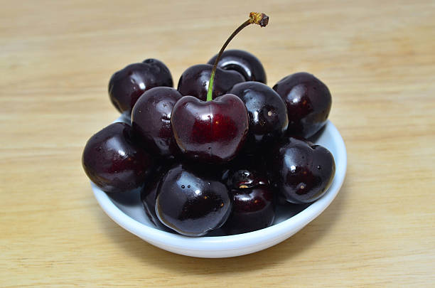 istock Fresh and sweet cherry in white bowl 586057854