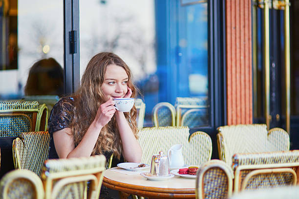 istock Beautiful Parisian woman in cafe 586058184