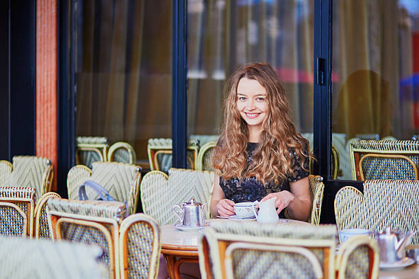 istock Beautiful Parisian woman in cafe 586058306
