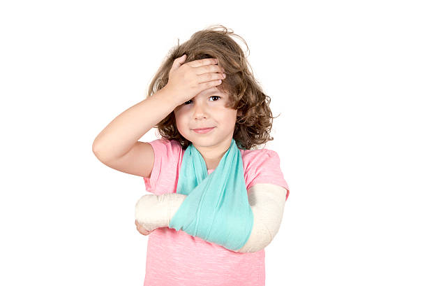 Little child with broken hand stock photo