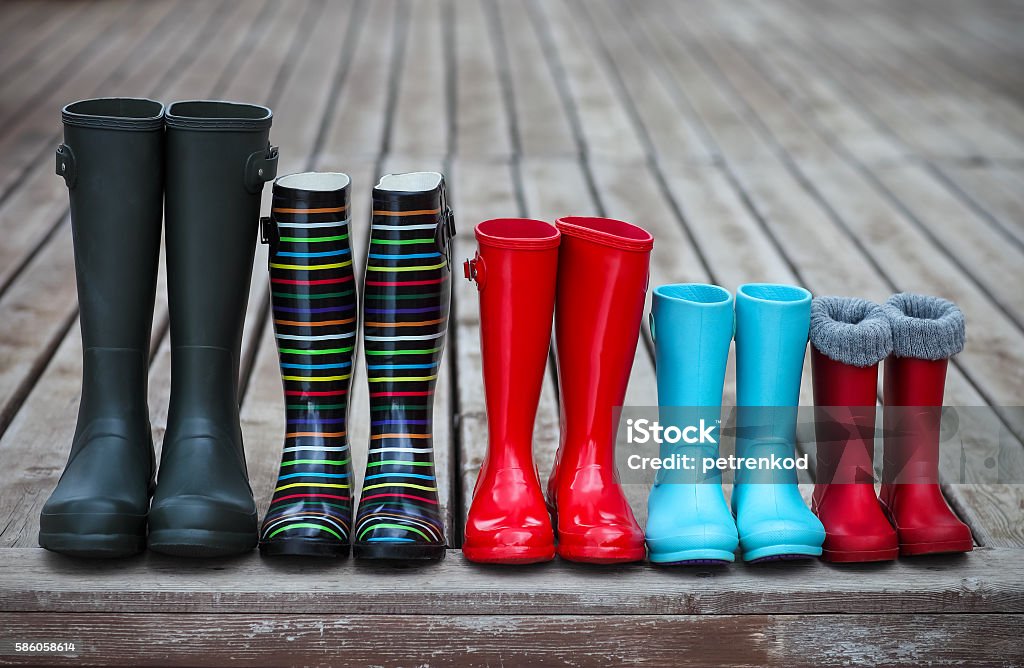 Five pairs of a colorful rain boots Five pairs of a colorful rain boots. Family concept Family Stock Photo