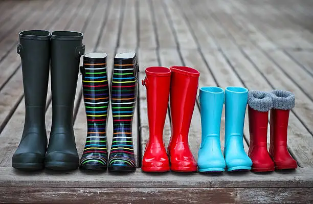 Five pairs of a colorful rain boots. Family concept