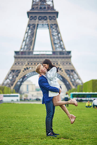istock Romantic couple in Paris near the Eiffel tower 586059248