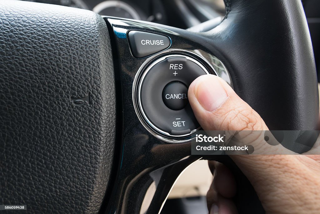 hand pushes Cruise control buttons Control Stock Photo