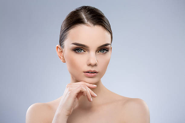 istock Beautiful girl with nude make up at studio 586060910