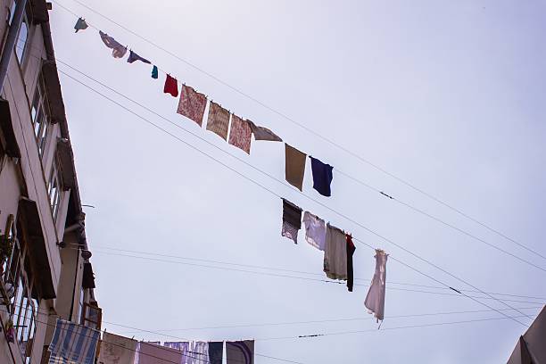 istock t-shirts on clothesline in front of blue sky 586061298