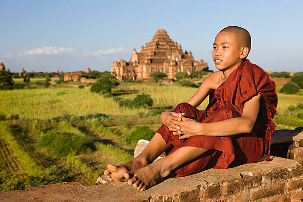 istock Young Buddhist monk looking at the Bagan's panorama 586061686