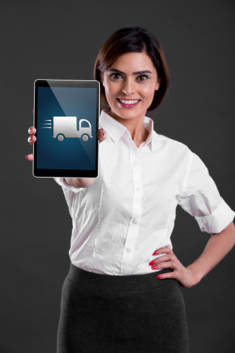 Young businesswoman showing a digital tablet