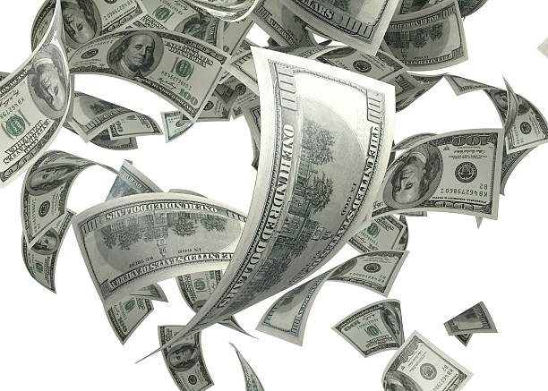 istock Hundred US Dollar Bills are Falling on White Background 586064496