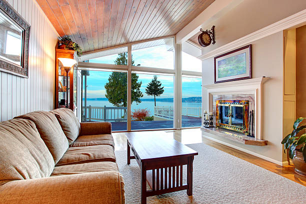 istock Awesome living room interior with sloped wooden ceiling 586069068