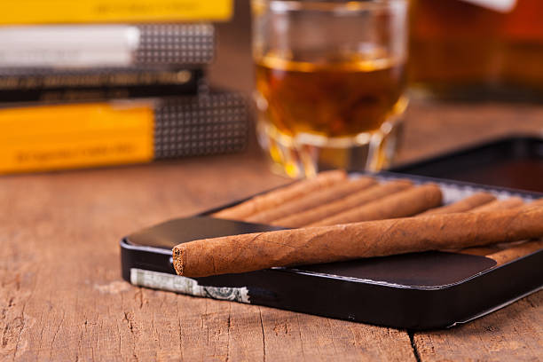 istock cigars and whisky on old wooden table 586069134